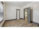 Bedroom boasting sleek floors and neutral trim, connecting seamlessly to a bathroom through an open door at 3028 Hovey St, Indianapolis, IN 46218