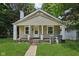 Charming single-Gathering home featuring a welcoming front porch and well-maintained lawn at 3028 Hovey St, Indianapolis, IN 46218