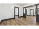 A cozy living room with light wood-look floors, perfect for relaxation at 3028 Hovey St, Indianapolis, IN 46218