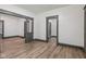 Open-concept living room with new flooring, neutral walls, and elegant gray trim at 3028 Hovey St, Indianapolis, IN 46218