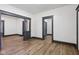 Open living area showcasing new flooring, gray trim, and a spacious layout for entertaining at 3028 Hovey St, Indianapolis, IN 46218