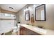 Bathroom with dual sinks, bath tub, and neutral color palette at 311 S 6Th Ave, Beech Grove, IN 46107
