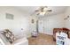 Bright Bedroom with natural light, rocker, and neutral decor at 311 S 6Th Ave, Beech Grove, IN 46107