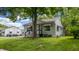 Charming home featuring a well-maintained lawn and a covered front porch, enhancing its curb appeal at 311 S 6Th Ave, Beech Grove, IN 46107