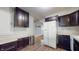Kitchen with stainless appliances and dark wood cabinets at 311 S 6Th Ave, Beech Grove, IN 46107