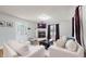 Bright living room features a fireplace and large window for ample natural light at 311 S 6Th Ave, Beech Grove, IN 46107
