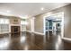 Spacious living room with hardwood floors, fireplace, and ample natural light at 33 N Webster Ave, Indianapolis, IN 46219