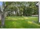 Expansive backyard enclosed by a wood privacy fence, creating a secluded outdoor space at 3365 Riverside Dr, Columbus, IN 47203