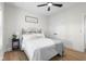 Cozy bedroom featuring comfortable bedding, a ceiling fan, and natural light at 3365 Riverside Dr, Columbus, IN 47203
