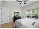 Bedroom with light filled windows and a view of the backyard at 3365 Riverside Dr, Columbus, IN 47203