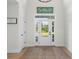 Bright entryway featuring beautiful natural light and warm wood flooring, creating a welcoming ambiance at 3365 Riverside Dr, Columbus, IN 47203