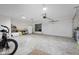 Spacious garage with an organized tool area, workbench, storage, and ample open space for parking at 3365 Riverside Dr, Columbus, IN 47203