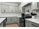 Elegant kitchen featuring stainless steel appliances, shaker cabinets, and light countertops at 3365 Riverside Dr, Columbus, IN 47203