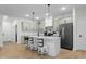 Charming kitchen with a breakfast bar, stylish pendant lighting, and stainless steel appliances at 3365 Riverside Dr, Columbus, IN 47203