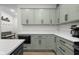 Stylish kitchen featuring shaker cabinets, light countertops, and stainless steel appliances at 3365 Riverside Dr, Columbus, IN 47203