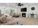 Comfortable living room featuring modern decor, inviting seating, and a fireplace for cozy evenings at 3365 Riverside Dr, Columbus, IN 47203