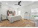 Stylish main bedroom with wooden headboard, cozy rug, and white dresser at 3365 Riverside Dr, Columbus, IN 47203
