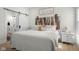 Serene main bedroom with modern decor, wooden headboard, and natural light at 3365 Riverside Dr, Columbus, IN 47203