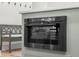 Built-in microwave appliance with shaker cabinets and light countertops at 3365 Riverside Dr, Columbus, IN 47203