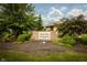 Landscaped community sign featuring 'Maple Grove Condominiums' at 3717 Bellmore Dr, Brownsburg, IN 46112