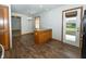 Open concept dining room with hardwood floors, a view into the yard, and a chandelier at 3717 Bellmore Dr, Brownsburg, IN 46112