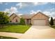 Charming brick home with a well-manicured lawn and a two-car garage at 3717 Bellmore Dr, Brownsburg, IN 46112