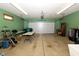 Spacious garage with lighting, shelving, and plenty of room for parking and storage at 3717 Bellmore Dr, Brownsburg, IN 46112