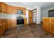 Bright kitchen with wood cabinets, stainless appliances, pantry and hardwood floors at 3717 Bellmore Dr, Brownsburg, IN 46112