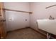 Functional laundry room with sink, shelving, and washer/dryer hookups at 3717 Bellmore Dr, Brownsburg, IN 46112