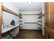 Walk-in closet equipped with shelving and hanging racks for optimal organization at 3717 Bellmore Dr, Brownsburg, IN 46112