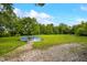 Large backyard with an above-ground pool and trees at 379 N Marion St, Morgantown, IN 46160
