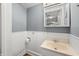 Bathroom featuring a white vanity and wainscoting at 379 N Marion St, Morgantown, IN 46160