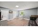 Spacious bedroom features neutral paint, plush carpet, and a charming vanity area with ample natural light at 379 N Marion St, Morgantown, IN 46160