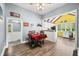Open dining room and kitchen area with breakfast bar and vintage accents at 379 N Marion St, Morgantown, IN 46160