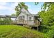 Charming two-story home with a wooden deck and mature landscaping at 379 N Marion St, Morgantown, IN 46160