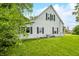 Two-story home with an American flag in a landscaped yard at 379 N Marion St, Morgantown, IN 46160