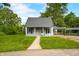 Beautiful home featuring a covered porch and well-manicured lawn at 379 N Marion St, Morgantown, IN 46160