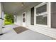 Inviting front porch with overhead lighting and neatly framed windows at 379 N Marion St, Morgantown, IN 46160