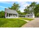 Charming two-story home with spacious front yard, detached garage and ample parking at 379 N Marion St, Morgantown, IN 46160