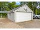 Well-maintained garage with modern door and ample parking at 379 N Marion St, Morgantown, IN 46160