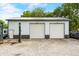 A large, white, two-door garage with an RV parked on the left shows ample storage and workspace at 379 N Marion St, Morgantown, IN 46160