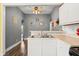 Eat-in kitchen with view into the dining room and light colored countertops at 379 N Marion St, Morgantown, IN 46160