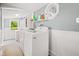 Bright laundry room with white washer and dryer units at 379 N Marion St, Morgantown, IN 46160