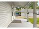 Covered porch with white posts and hanging light fixture at 379 N Marion St, Morgantown, IN 46160