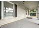 Covered porch with white siding, black shutters, and hanging lantern at 379 N Marion St, Morgantown, IN 46160