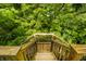 Wooden steps leading to lush greenery and mature trees at 379 N Marion St, Morgantown, IN 46160