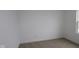 Bright bedroom featuring soft carpet, white walls, and a window for ample sunlight at 3917 Highcrest Rd, Indianapolis, IN 46239