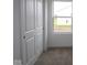 Cozy bedroom with plush carpet, closet, and a window providing natural light at 3917 Highcrest Rd, Indianapolis, IN 46239