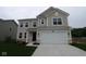 Charming two-story home featuring a two-car garage, neutral siding and manicured lawn at 3917 Highcrest Rd, Indianapolis, IN 46239