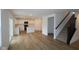 Open concept living space features a combined living room, kitchen, and staircase at 3917 Highcrest Rd, Indianapolis, IN 46239